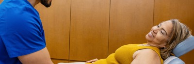 MSK acupuncturist Charles Rico is seen giving acupressure to patient Elizabeth Sosa at the MSK Ralph Lauren Center. 