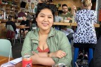 Irene Dimatulac sitting at a table in a restaurant
