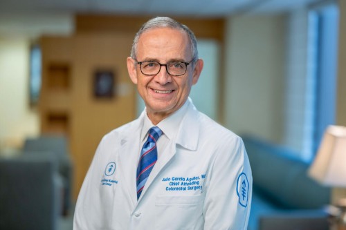Colorectal surgeon Dr. Julio Garcia-Aguilar seen smiling in office.