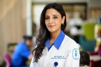 Dr. Mini Kamboj smiling and wearing an MSK lab coat