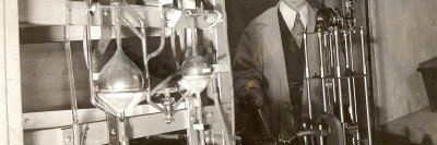 Man working at radon gas capture apparatus at Memorial Hospital.