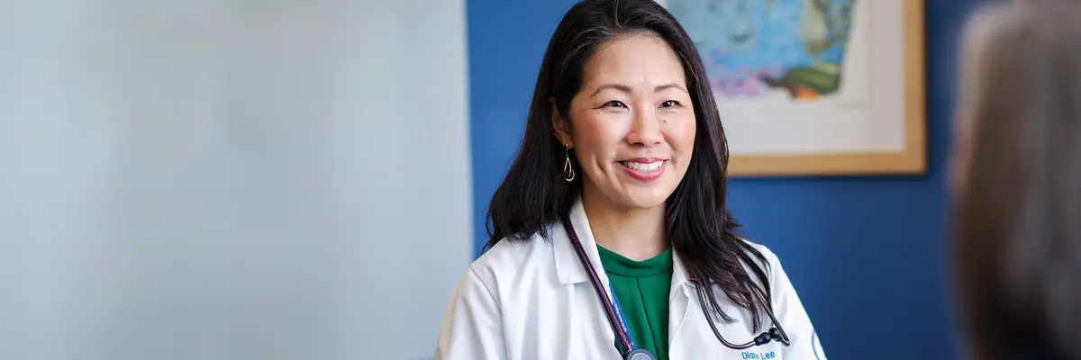 Nurse Practitioner Diane Lee in conversation with a patient